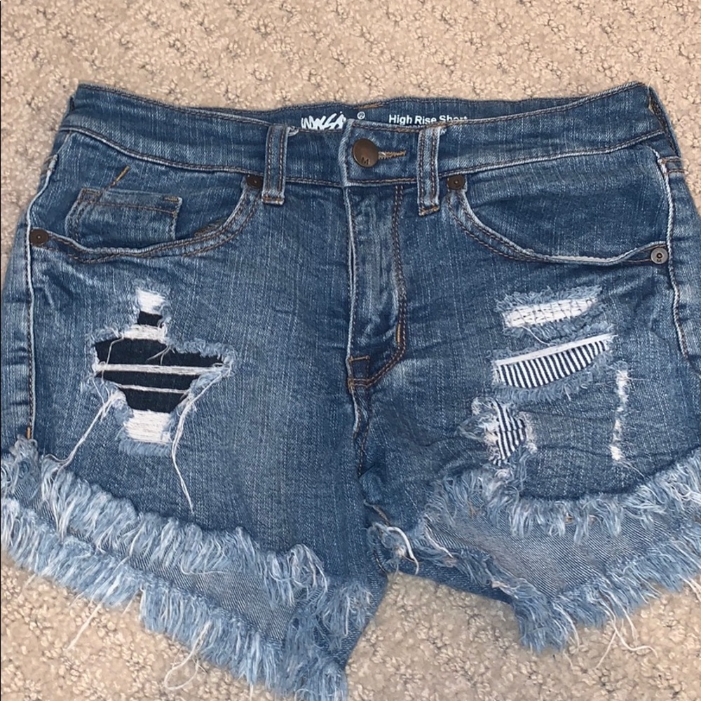 distressed medium wash jean shorts